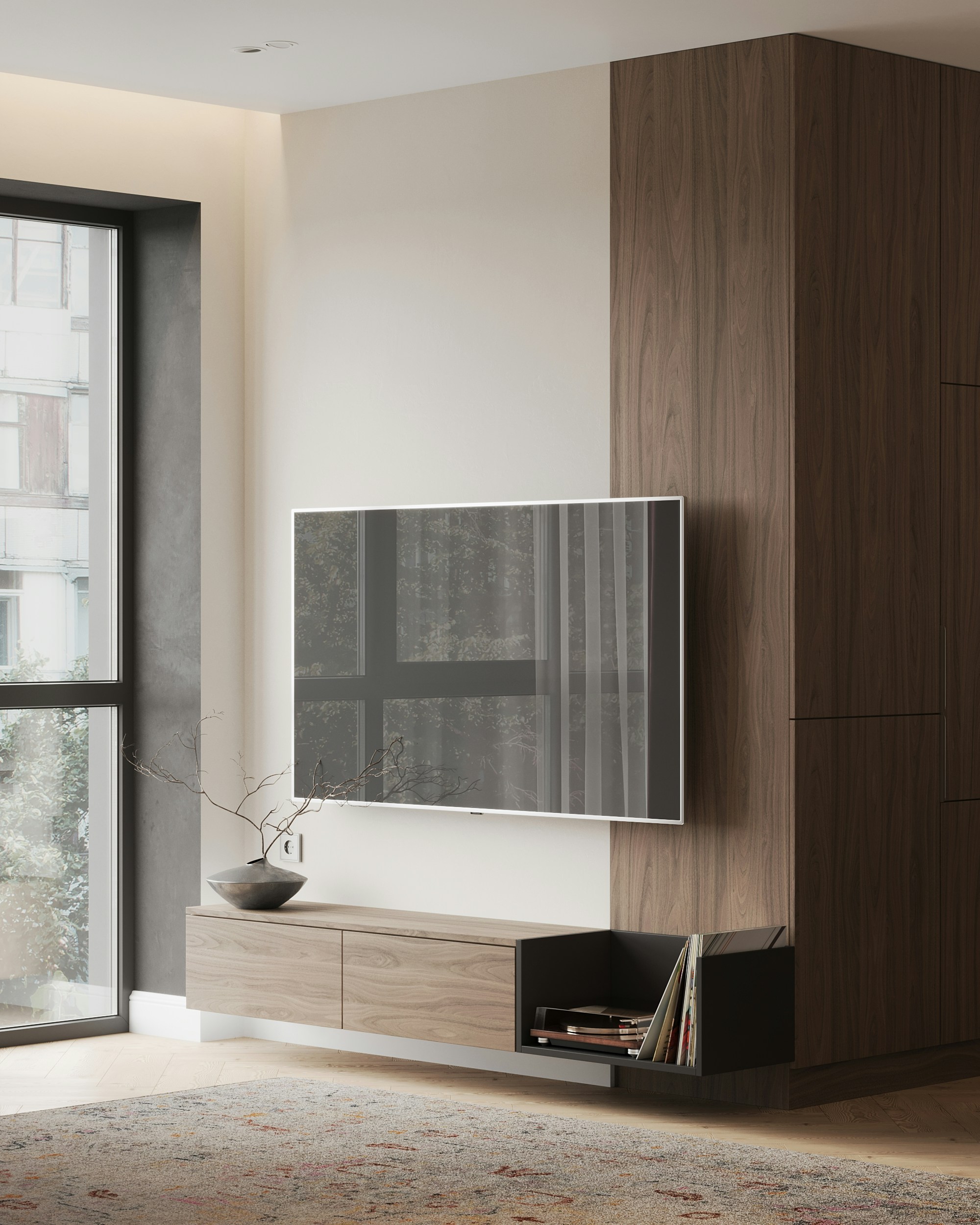 Modern living room corner with a wall-mounted flat-screen TV, floating wooden cabinet, decorative vase with branches, and records stored in a black open shelf.