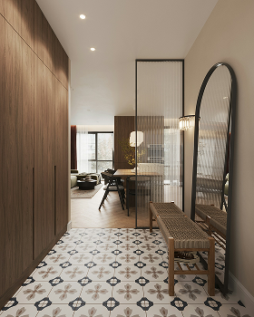 Modern hallway with patterned tile floor, wooden closet, wicker bench, large arched mirror, and view into a living and dining area.